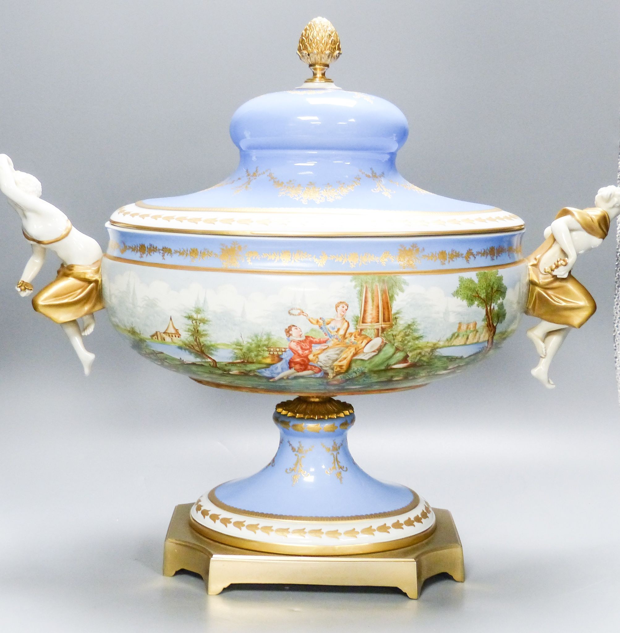 A large 20th century Sevres style porcelain and brass mounted pedestal vase and cover, 49 cm wide